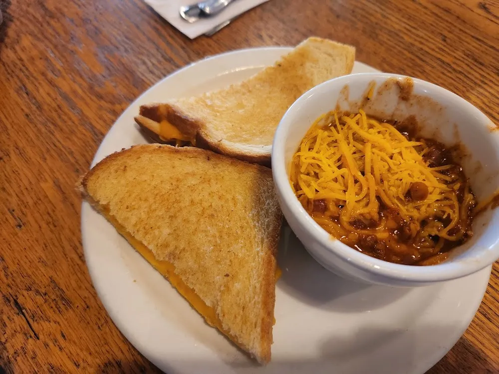 Grilled Cheddar Cheese on Sour Dough Bread with Cup of Chili